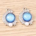Celestial crescent moon charm with blue opal-like glitter and white faux pearls - White K Base - Blue