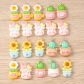 Flat lay of colorful resin flower and cactus charms with metal rings for DIY jewelry - 10 Pieces Pack / Cactus Sunflower Mixed Models