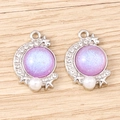 Detailed view of crescent moon pendants with purple glitter, pearls and tiny stars - White K Base - Purple