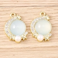 Detail showing moon and star charms with opal stones, pearls, and rhinestones for DIY jewelry - Gold Base - Fog Blue