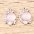 Detailed view of silver moon charms with pink stone and small sparkling rhinestones - White K Base - Pink