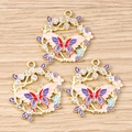 Detailed macro view of three butterfly wreath pendants with colorful enamel and crystals - 10 Pieces Pack / Pink Butterfly Wreath