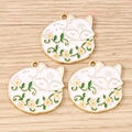 Detailed macro view of three white enamel fox pendants with golden trim and floral details - 10 Pieces Pack / Vine Flower Fox