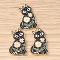 Detailed close-up of three black cat enamel charms with white daisy patterns on wood - 10 Pieces Pack / Black Flower Cat