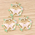 Close-up of golden butterfly flower wreaths with pastel enamel and sparkling rhinestones - 10 Pieces Pack / White Wreath Butterfly