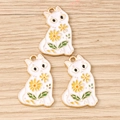 Detailed close-up of colorful daisy cat enamel charms on a light wood background - 10 Pieces Pack / White Flower Cat
