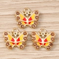 Set mit drei goldenen Strass-Schmetterlingsanhängern mit Emaille für DIY-Schmuck - 10er Pack / Gelb
