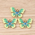 Detailed macro view of colorful enamel butterfly charms for DIY jewelry making and crafts - 10 Pieces Pack / Green Butterfly