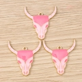 Close-up of pink enamel bull skull pendants with gold plating for DIY jewelry making - 10 Pieces Pack / Pink Bull Head