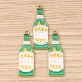 Detailed macro view of three green enamel beer bottle charms with gold wheat and BEER text - 10 Pieces Pack / Beer