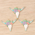 Dettaglio di ciondoli a teschio di mucca stile western con fiori per gioielli fai da te - Confezione da 10 / Testa di Toro Blu