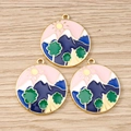 Three enamel nature pendants with gold plating and mountain motifs on wood background - 10 Pieces Pack / Pink Landscape Round Plate