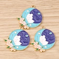 Macro shot of three rabbit and moon enamel charms on light wood texture background - 10 Pieces Pack / Blue Flower Moon