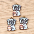 Detail of blue cartoon pug dog charms with gold trim on light wood background - Pug Dog Drinking / 10 Pieces Pack / Blue and Purple