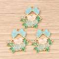 Detailed macro view of three enamel flower rabbit alloy charms for DIY jewelry making - 10 Pieces Pack / Blue Bowknot Rabbit