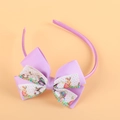 Purple Easter bunny print bow headband for girls featuring festive colorful egg patterns - Purple