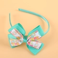 Easter headband with green satin wrap and double-layered bow featuring egg and chick prints - Emerald Green