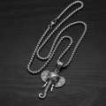 Macro view of vintage stainless steel elephant head pendant with intricate box chain detail - Pendant With Box Chain / Steel