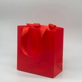 Premium matte red paper gift bag with matching ribbon handles for elegant jewelry packaging - Red Handbag; 14*15*7cm