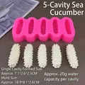 Detail view of 5-cavity pink silicone mold and white realistic sea cucumber textures - 5-piece Sea Cucumber Mold Pink