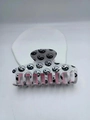 Classic Tai Chi Yin Yang hair claw clip with pink interior on a white stone display - Black And White Tai Chi Pattern (Pink Interior)