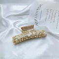 Large acetate hair claw clip with beige marble texture on white satin background - Beige