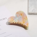 Pinza de pelo de corazón en acetato jaspeado rosa y naranja con dientes dorados - Forma de Corazón 7.2cm