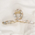 Elegante pinza per capelli in acetato marmorizzato bianco e ambra con molla dorata - Marmo Bianco Blu