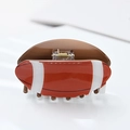 Creative American football shaped hair claw clip in reddish brown acrylic with white stripes - Rugby (9cm)