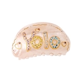 Close-up of pink acetate hair claw with Yolo lettering and colorful rhinestones - Champagne