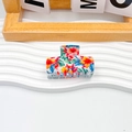 Eleganter PVC Haarklammer mit bunten tropischen Blumendrucken und zehn Zähnen Griff - 6cm / Dunkelorange