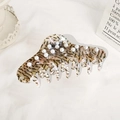 Large tortoiseshell acetate hair claw clip with elegant white pearls on a soft background - Floral Grey
