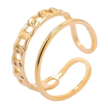 Detailed macro view of gold-plated double-layer ring with smooth and cuban link chain design - Gold