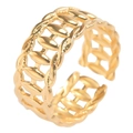 Macro detail of golden open ring with hollow olive leaf pattern and polished finish - Gold
