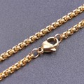 Macro shot of 2.5mm gold stainless steel box chain necklace with durable lobster clasp - 20cm / Gold