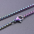 Macro detail of iridescent 2.5mm stainless steel box chain with lobster clasp closure - 20cm / Rainbow