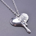 Macro shot of polished silver heart pendant with unique liquid melting design effect - Necklace / Steel