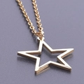 Detailed close-up of a 18k gold-plated pentagram star pendant necklace with high-polish finish - Necklace / Gold