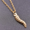Macro shot of gold 18K stainless steel chili pendant with spiral texture detail - Gold Necklace