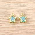 Macro shot of light blue star charms with gold frames on a rustic wooden background - 5 Pieces / Gold Blue