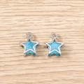 Macro detail of blue crystal star pendants with silver metal frames for DIY jewelry - 5 Pieces / Silver Blue