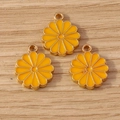 Detailed view of yellow daisy enamel flower charms with gold metal loops for DIY jewelry - Yellow