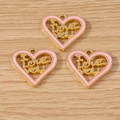 Close-up of heart-shaped I Love You pendants with pink enamel for DIY jewelry making - ILOVEYOU Heart Style / 10 Pieces Pack / Pink