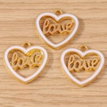 Detail of three golden heart pendants with white enamel and cursive love lettering - LOVE Heart Style / 10 Pieces Pack / White