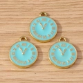 Close-up of light blue enamel clock pendants with gold alloy frame for DIY jewelry - 10 Pieces Pack / Blue