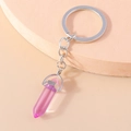 Detail of pink hexagonal crystal column keychain with silver ring and polished finish - Purple