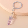Close-up of a purple hexagonal crystal bullet pendant on a silver metal keychain - Ice Purple