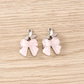 Vue détaillée de pendentifs papillon rose avec des strass blancs brillants et alliage - Style Double Papillon / 5 Pièces / Rose Argent
