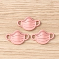 Detailed view of pink resin mask pendants for DIY jewelry and handicraft making - 10 Pieces Pack / Pink Mask