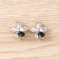Detail view of two silver floral pendants with black crystal centers for jewelry making - Silver Black